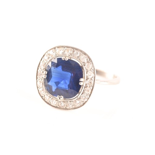 35 - An early 20th century natural and unenhanced sapphire, diamond and platinum ring, set with a cushion... 