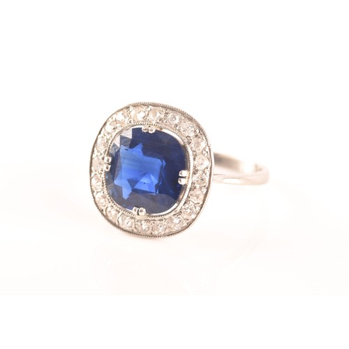 35 - An early 20th century natural and unenhanced sapphire, diamond and platinum ring, set with a cushion... 