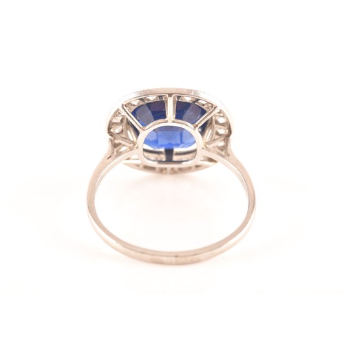 35 - An early 20th century natural and unenhanced sapphire, diamond and platinum ring, set with a cushion... 