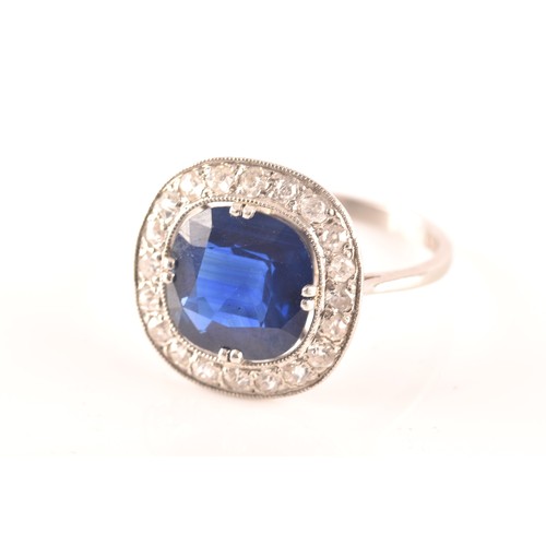 35 - An early 20th century natural and unenhanced sapphire, diamond and platinum ring, set with a cushion... 