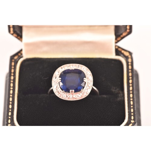 35 - An early 20th century natural and unenhanced sapphire, diamond and platinum ring, set with a cushion... 