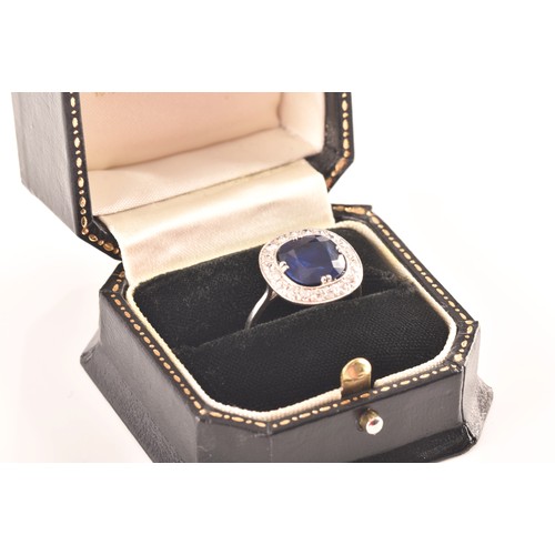 35 - An early 20th century natural and unenhanced sapphire, diamond and platinum ring, set with a cushion... 