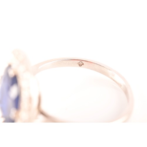 35 - An early 20th century natural and unenhanced sapphire, diamond and platinum ring, set with a cushion... 