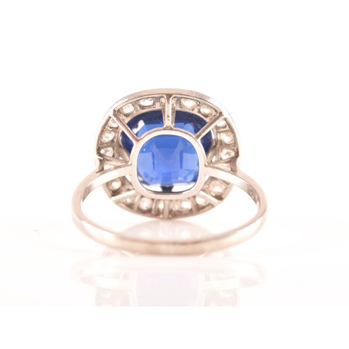 35 - An early 20th century natural and unenhanced sapphire, diamond and platinum ring, set with a cushion... 