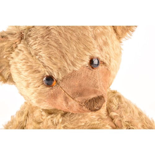 308 - A large 1920s mohair teddy bear, ‘Bruin’, with articulated head, legs and arms. 60 cm long.