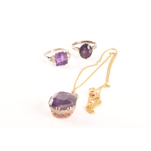 87 - A 15ct yellow gold and silver pendant and chain set with a cushion shape mixed cut amethyst with an ... 