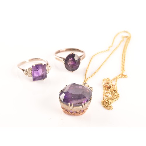 87 - A 15ct yellow gold and silver pendant and chain set with a cushion shape mixed cut amethyst with an ... 