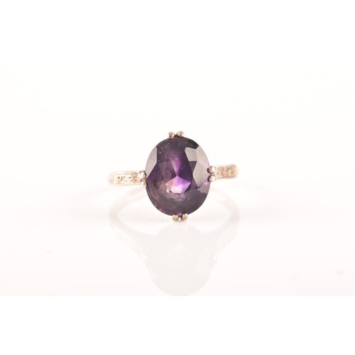 87 - A 15ct yellow gold and silver pendant and chain set with a cushion shape mixed cut amethyst with an ... 