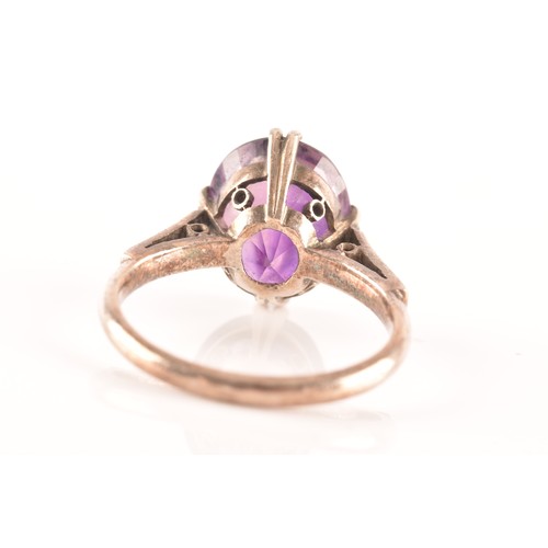 87 - A 15ct yellow gold and silver pendant and chain set with a cushion shape mixed cut amethyst with an ... 