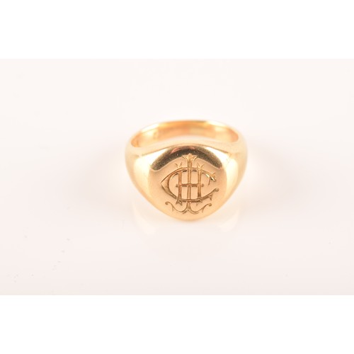 96 - A 18 carat yellow gold engraved signet ring, engraved plaque top, worn English hallmarks, maker's ma... 