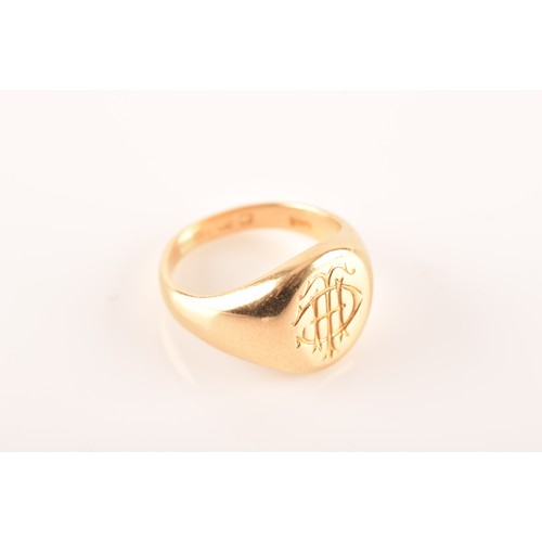 96 - A 18 carat yellow gold engraved signet ring, engraved plaque top, worn English hallmarks, maker's ma... 