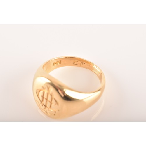 96 - A 18 carat yellow gold engraved signet ring, engraved plaque top, worn English hallmarks, maker's ma... 