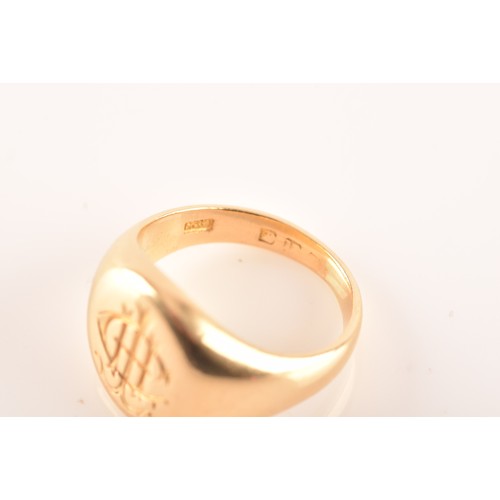 96 - A 18 carat yellow gold engraved signet ring, engraved plaque top, worn English hallmarks, maker's ma... 