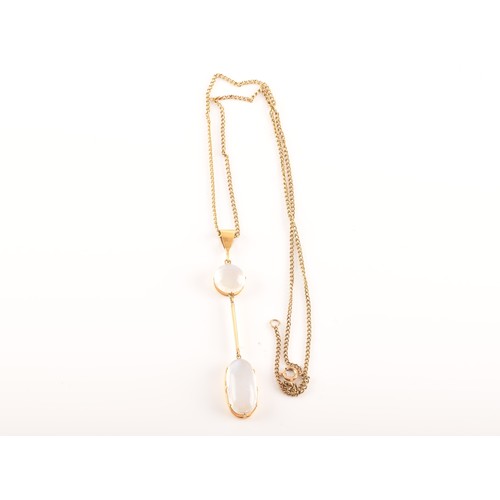 64 - A yellow metal moonstone drop pendant, set with a oval cabochon moonstone with an approximate weight... 