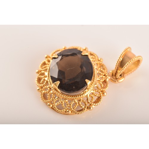 3 - A small group of gold jewellery, including a 10ct yellow gold almandine garnet set ring, an 18ct yel... 