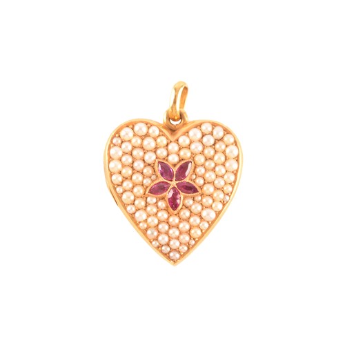 65 - A 18ct yellow gold heart locket pendant set to centre with four rubies with an combined approximate ... 