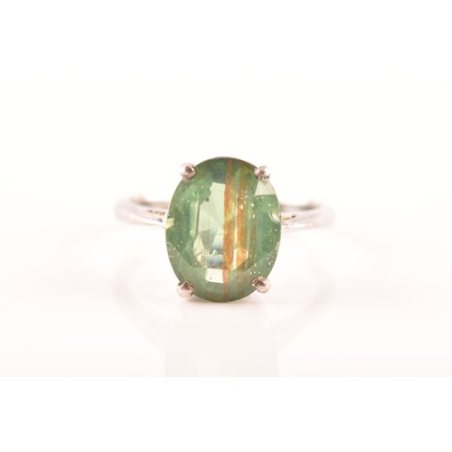 66 - A silver solitaire ring set with a green stone, size M 1/2, 3.4 grams, and a silver and yellow metal... 