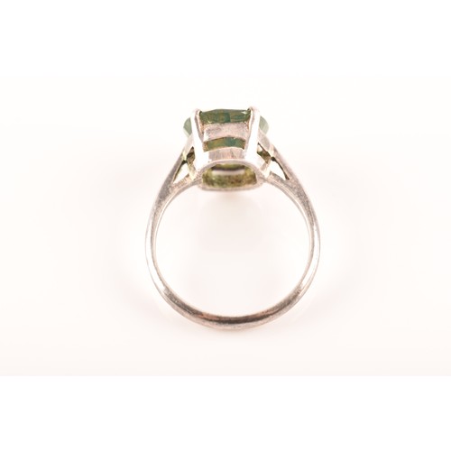 66 - A silver solitaire ring set with a green stone, size M 1/2, 3.4 grams, and a silver and yellow metal... 