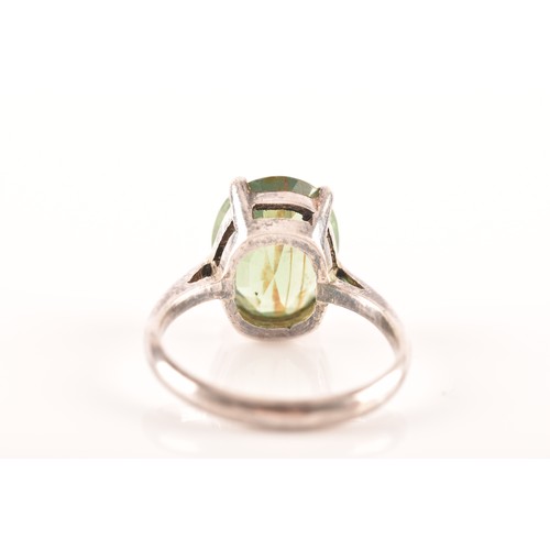 66 - A silver solitaire ring set with a green stone, size M 1/2, 3.4 grams, and a silver and yellow metal... 