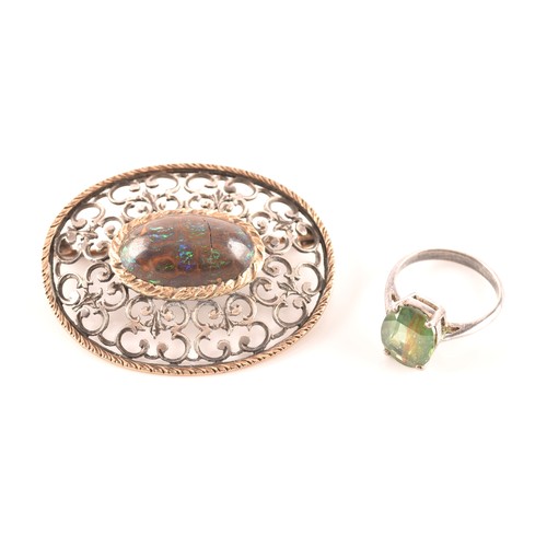 66 - A silver solitaire ring set with a green stone, size M 1/2, 3.4 grams, and a silver and yellow metal... 