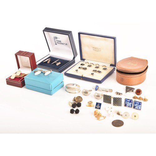 74 - A selection of cufflinks including an onyx and pearl gentlemans dress set in original fitted box, a ... 