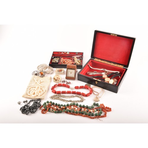 75 - A group of costume jewellery including a rose metal and opal ring, gold metal charms and studs, a pe... 