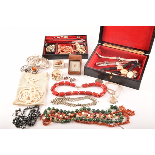 75 - A group of costume jewellery including a rose metal and opal ring, gold metal charms and studs, a pe... 