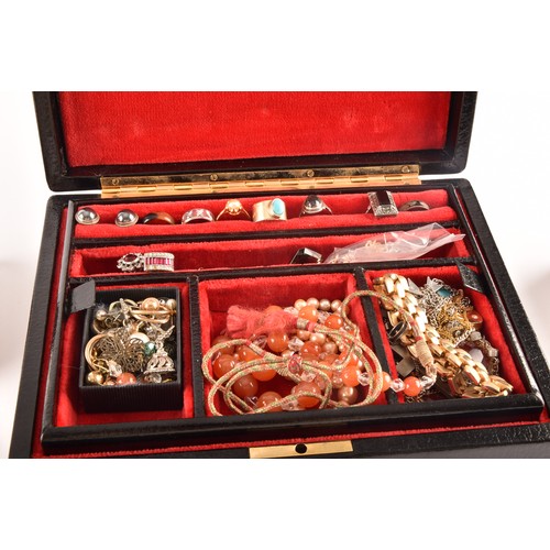 75 - A group of costume jewellery including a rose metal and opal ring, gold metal charms and studs, a pe... 