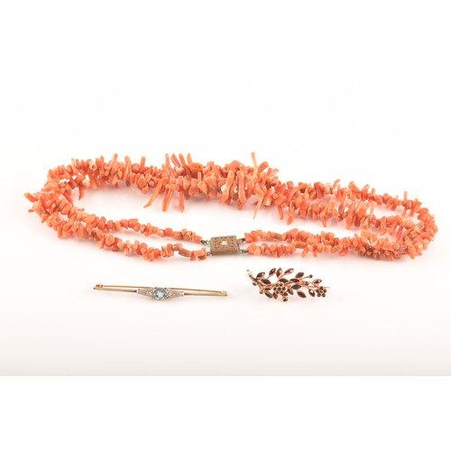 76 - A coral branch necklace with metal clasp, approximately 8 inches in length, a yellow metal zircon an... 