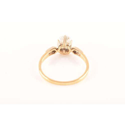 37 - A 18 carat yellow gold diamond solitaire, set to centre with a round brilliant cut diamond with an a... 