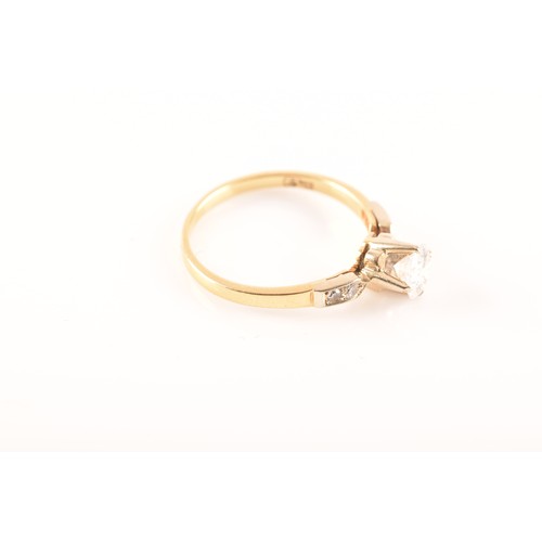 37 - A 18 carat yellow gold diamond solitaire, set to centre with a round brilliant cut diamond with an a... 