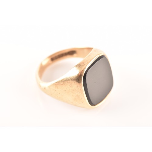 38 - A 9ct yellow gold and onyx ring, full hallmarks for Birmingham 1967, size M 1/2, and a 9ct yellow go... 