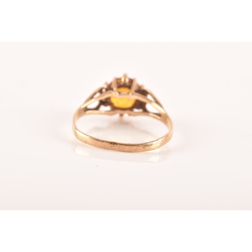 43 - A small group of gold rings, including a 9ct yellow gold garnet and paste ring, featuring full hallm... 