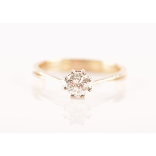 79 - A 14 carat white gold solitaire ring, featuring a round brilliant cut diamond with an approximate we... 