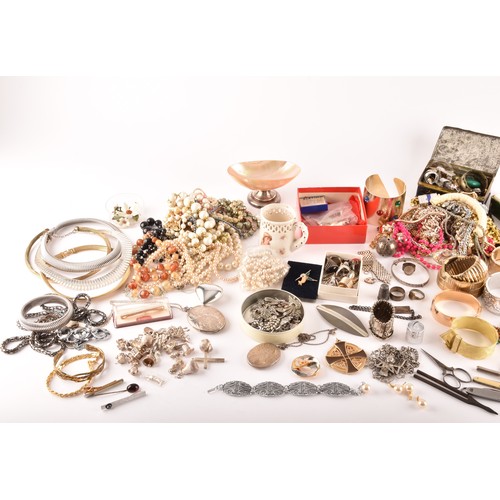 54 - A large collection of costume jewellery and miscellaneous items to include, a silver charm bracelet,... 