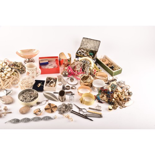 54 - A large collection of costume jewellery and miscellaneous items to include, a silver charm bracelet,... 