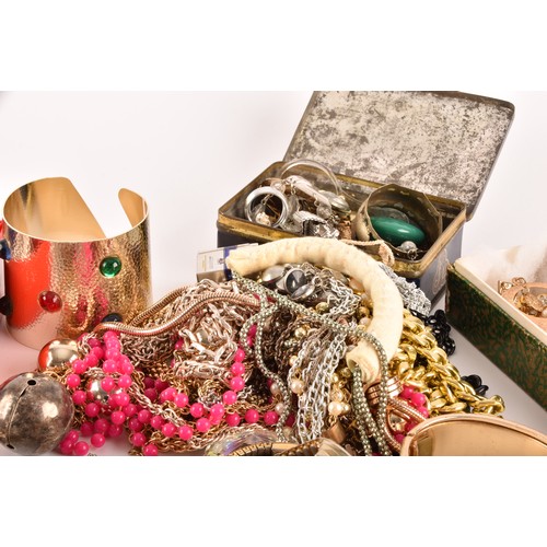 54 - A large collection of costume jewellery and miscellaneous items to include, a silver charm bracelet,... 