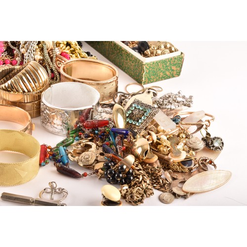 54 - A large collection of costume jewellery and miscellaneous items to include, a silver charm bracelet,... 