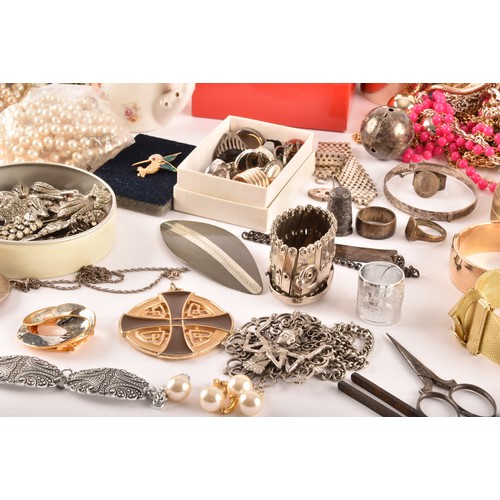 54 - A large collection of costume jewellery and miscellaneous items to include, a silver charm bracelet,... 