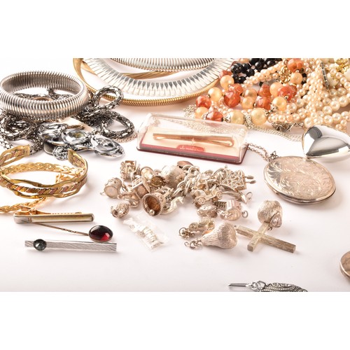 54 - A large collection of costume jewellery and miscellaneous items to include, a silver charm bracelet,... 