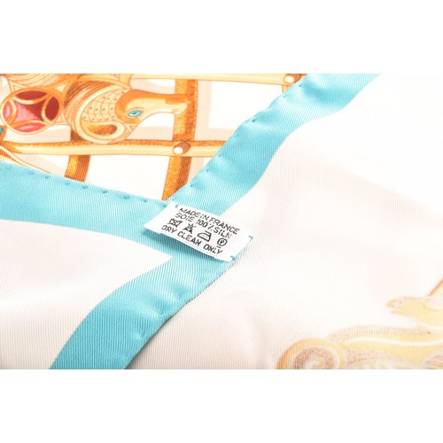 313 - Hermes, Paris. A silk scarf, 'L'Hiver en Poste' design, green and cream ground, 89 x 89 cm, boxed, t... 