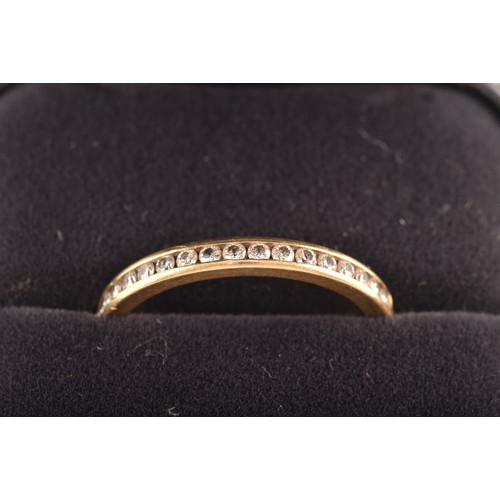 7 - Tiffany & Co. A Lucida 18ct yellow gold diamond half eternity ring, set with 17 brilliant cut di... 