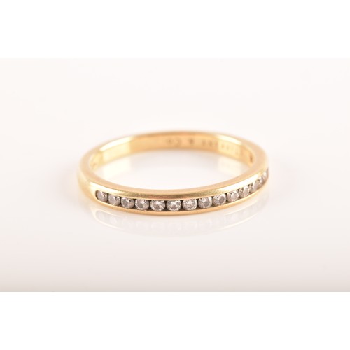 7 - Tiffany & Co. A Lucida 18ct yellow gold diamond half eternity ring, set with 17 brilliant cut di... 