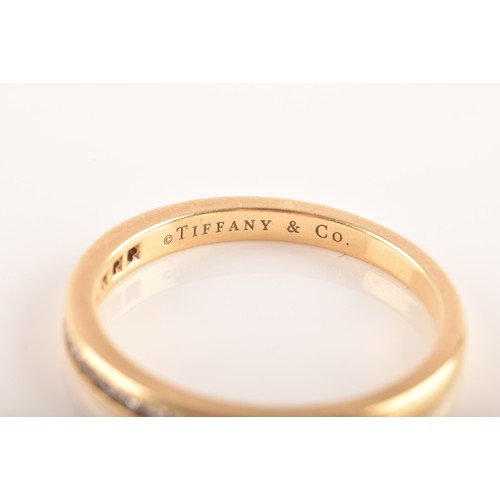 7 - Tiffany & Co. A Lucida 18ct yellow gold diamond half eternity ring, set with 17 brilliant cut di... 