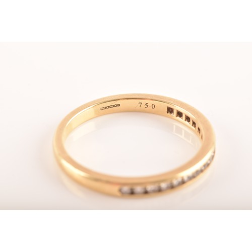 7 - Tiffany & Co. A Lucida 18ct yellow gold diamond half eternity ring, set with 17 brilliant cut di... 