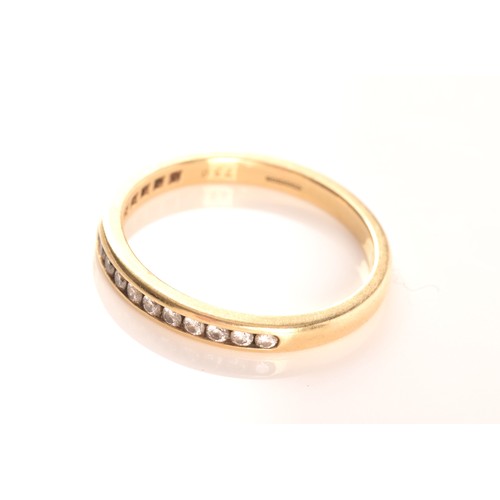 7 - Tiffany & Co. A Lucida 18ct yellow gold diamond half eternity ring, set with 17 brilliant cut di... 