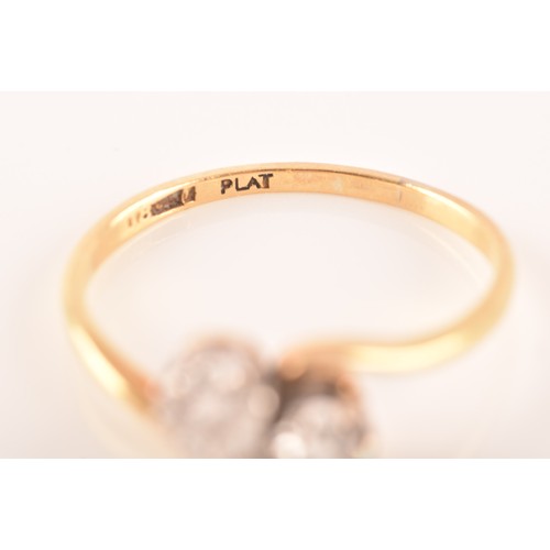 9 - A 18ct yellow gold and platinum two stone ring, set with two brilliant cut diamonds, approximately I... 