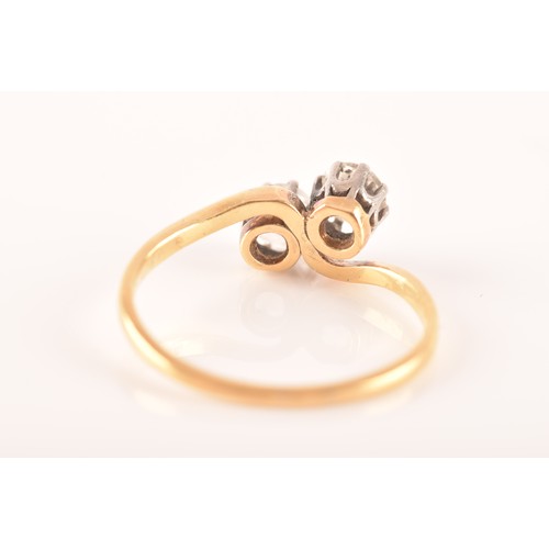 9 - A 18ct yellow gold and platinum two stone ring, set with two brilliant cut diamonds, approximately I... 