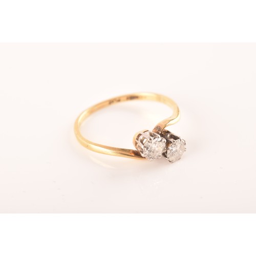 9 - A 18ct yellow gold and platinum two stone ring, set with two brilliant cut diamonds, approximately I... 