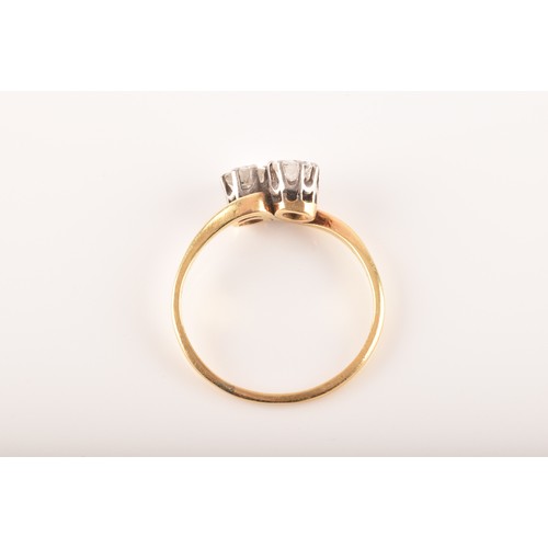 9 - A 18ct yellow gold and platinum two stone ring, set with two brilliant cut diamonds, approximately I... 